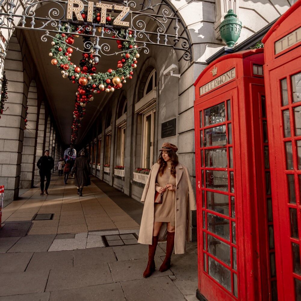 festive London street with two red phone boxes, the image has been filtered to bring out the bright red colours